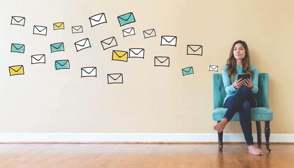 young woman sitting in a chair using a mobile device, with drawn images of envelopes floating off to the side