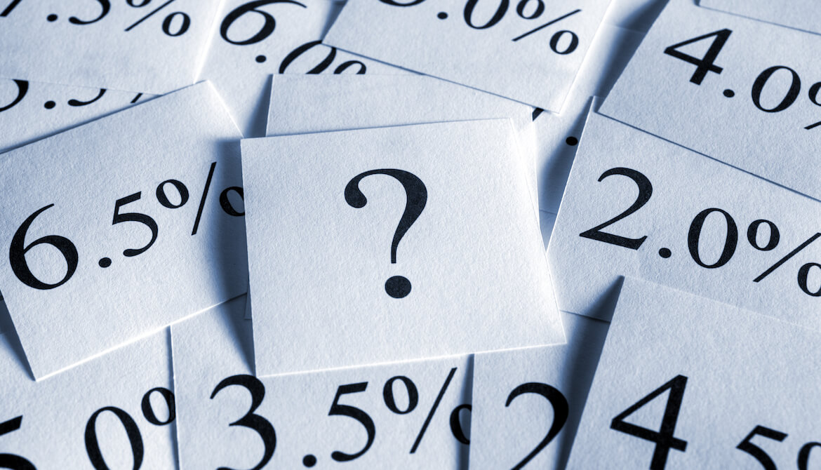many cards displaying interest rates around a central question mark