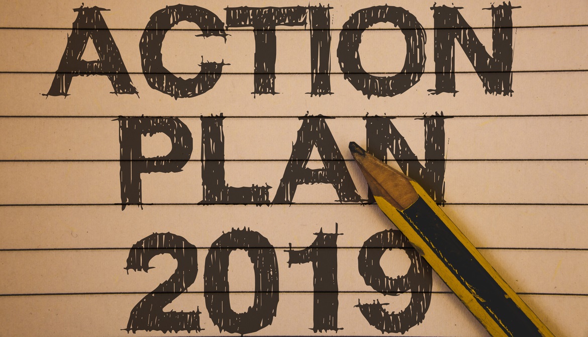 action plan 2019 scribbled on a notebook with a pencil 
