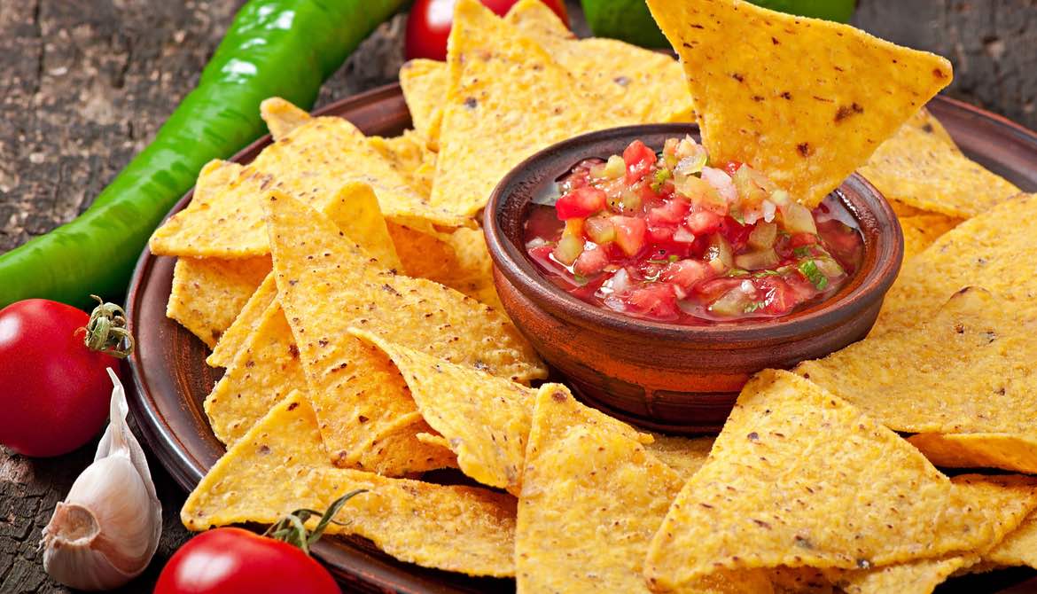 tortilla chips with salsa and peppers