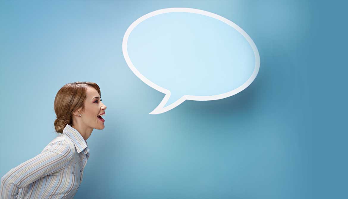 Woman speaking assertively with a blue speech bubble