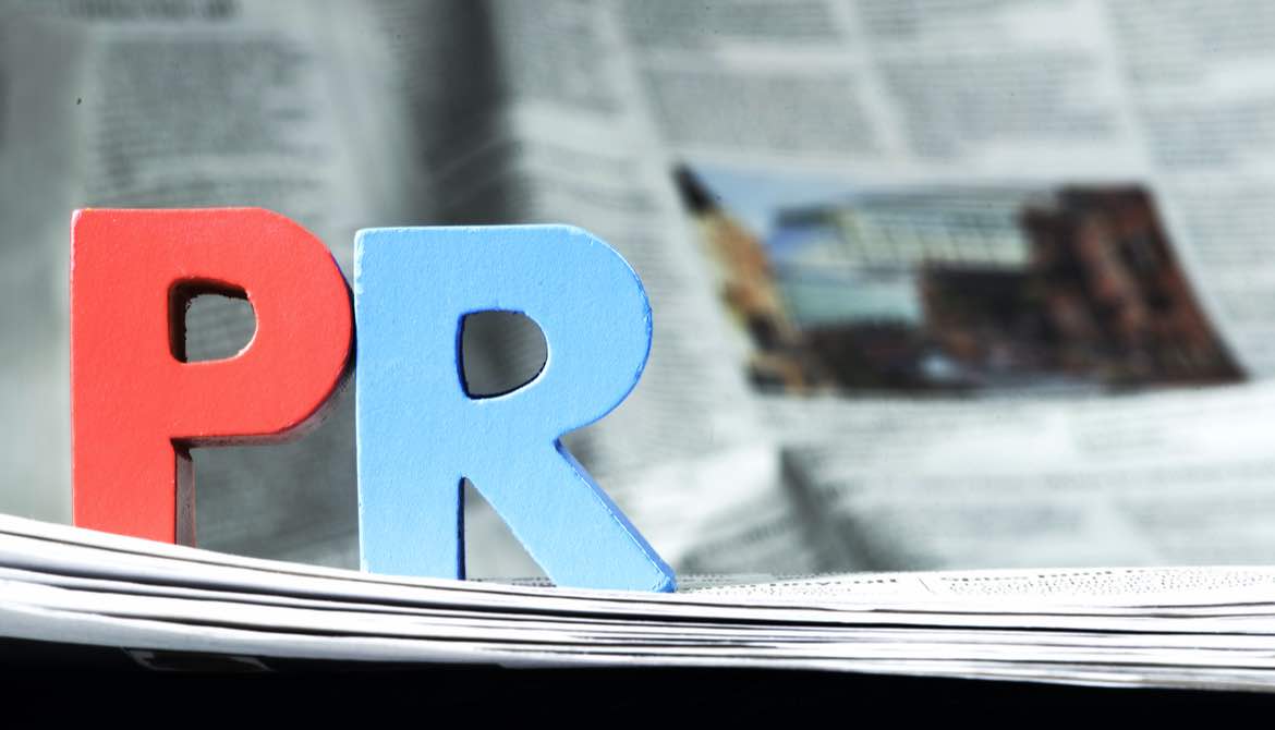 the letters P and R on top of newspapers