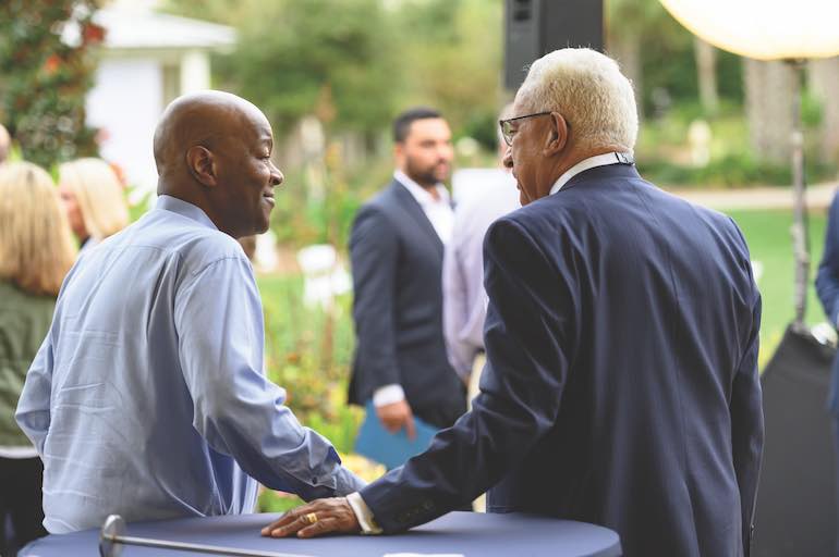 John Pembroke and Bob Ramirez share a moment at a CUES conference.