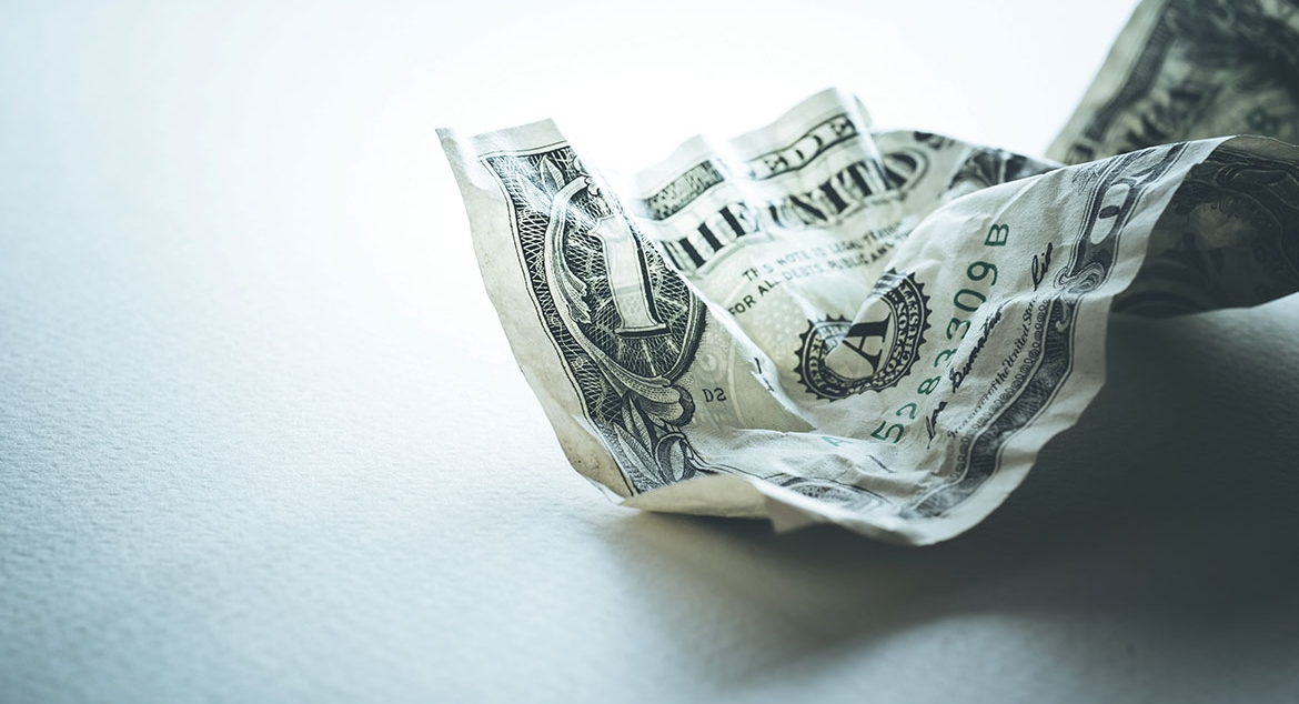crumpled dollar bill