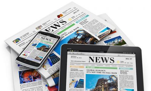 media news displayed on tablets and newspapers