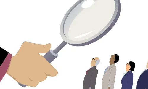 magnifying glass assessing leaders