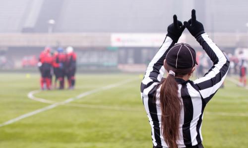 female referee on football field