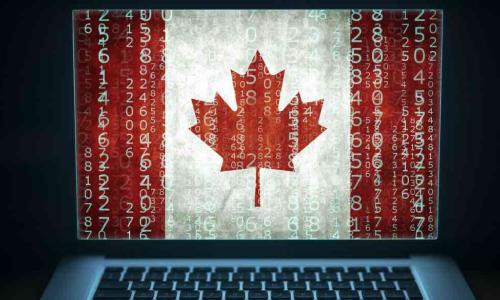  Laptop with binary computer code and Canada flag on the screen