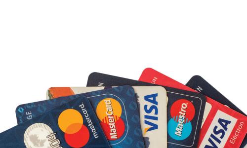 colorful fan of red white and blue credit cards from Visa and Mastercard