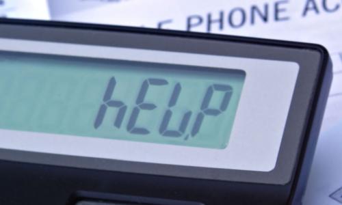Bills and calculator displaying HELP