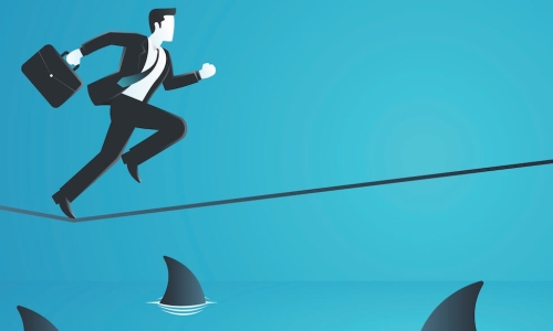illustration of a businessman running across a tightrope stretched over shark-filled water