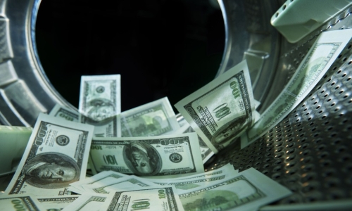 100 dollar bills inside a washing machine