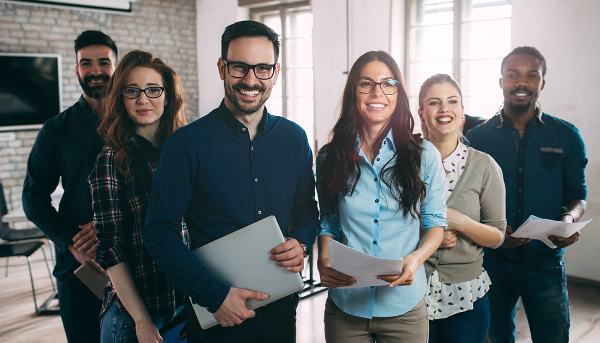 Group of happy employees at a successful company