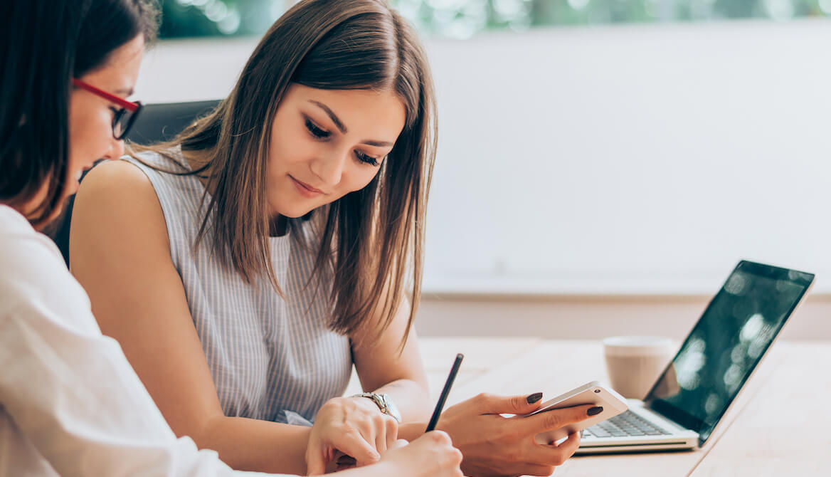 one business woman helping another