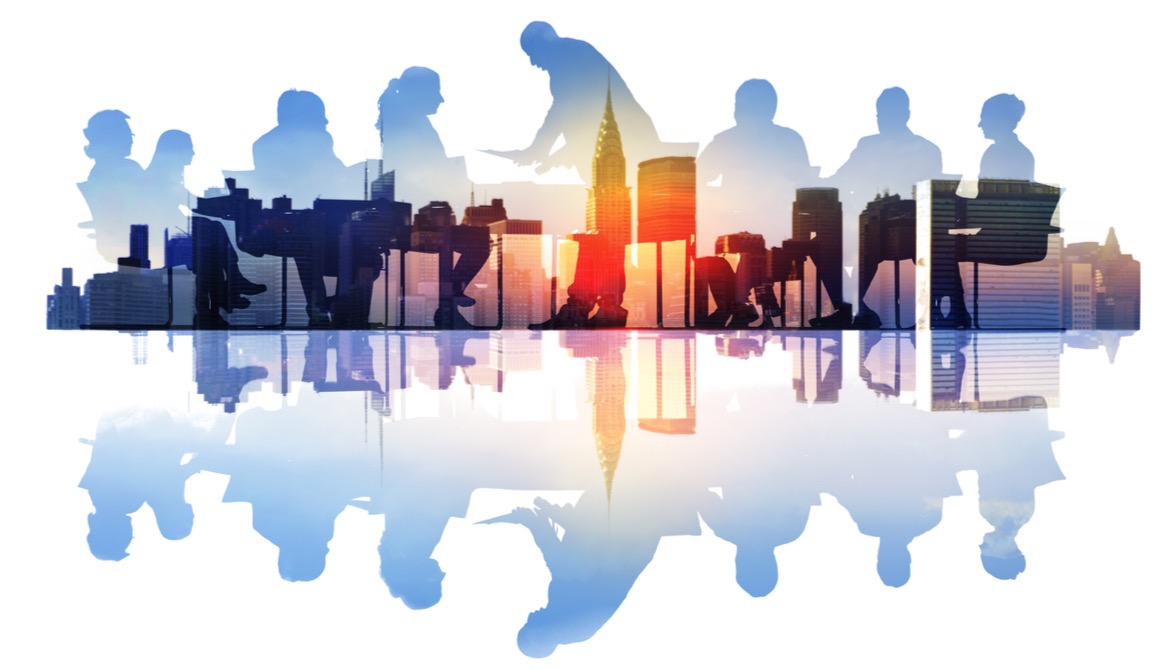 group at a board table superimposed over a city skyline