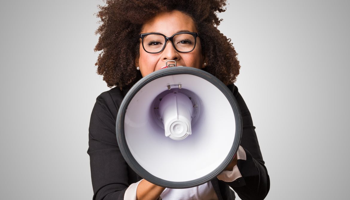 business woman using a megaphone