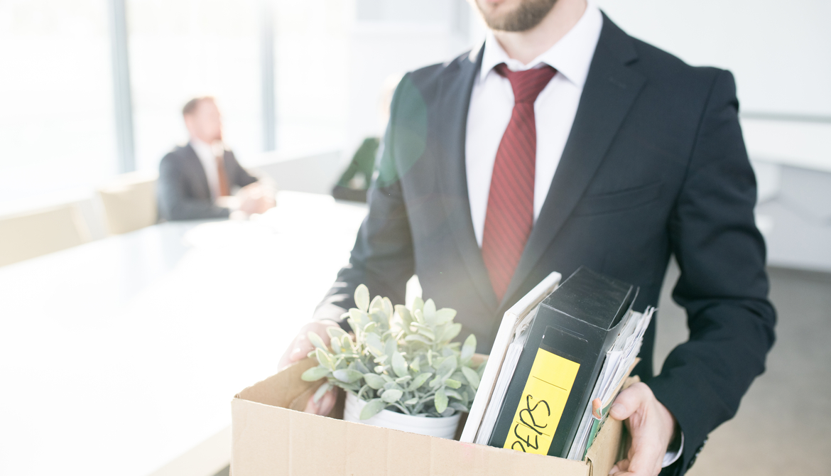 fired man leaving office with box