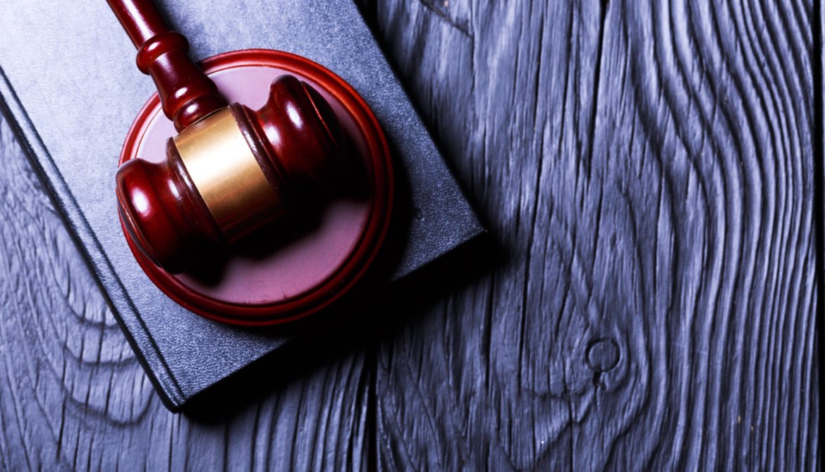 gavel on blue wooden background