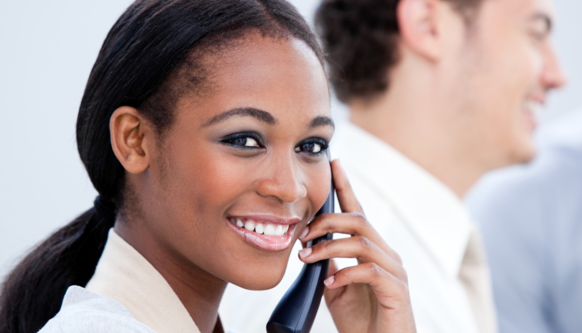 african-american business woman smiling while on the phone