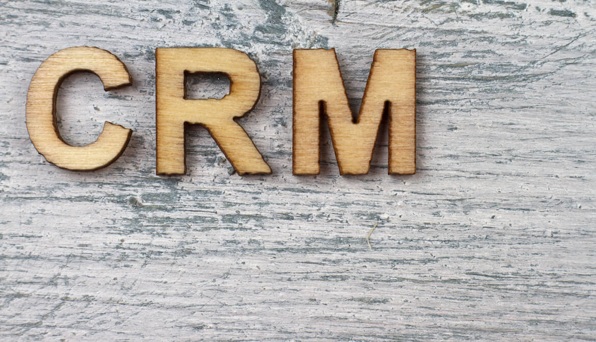 the letters C R M on a wooden table