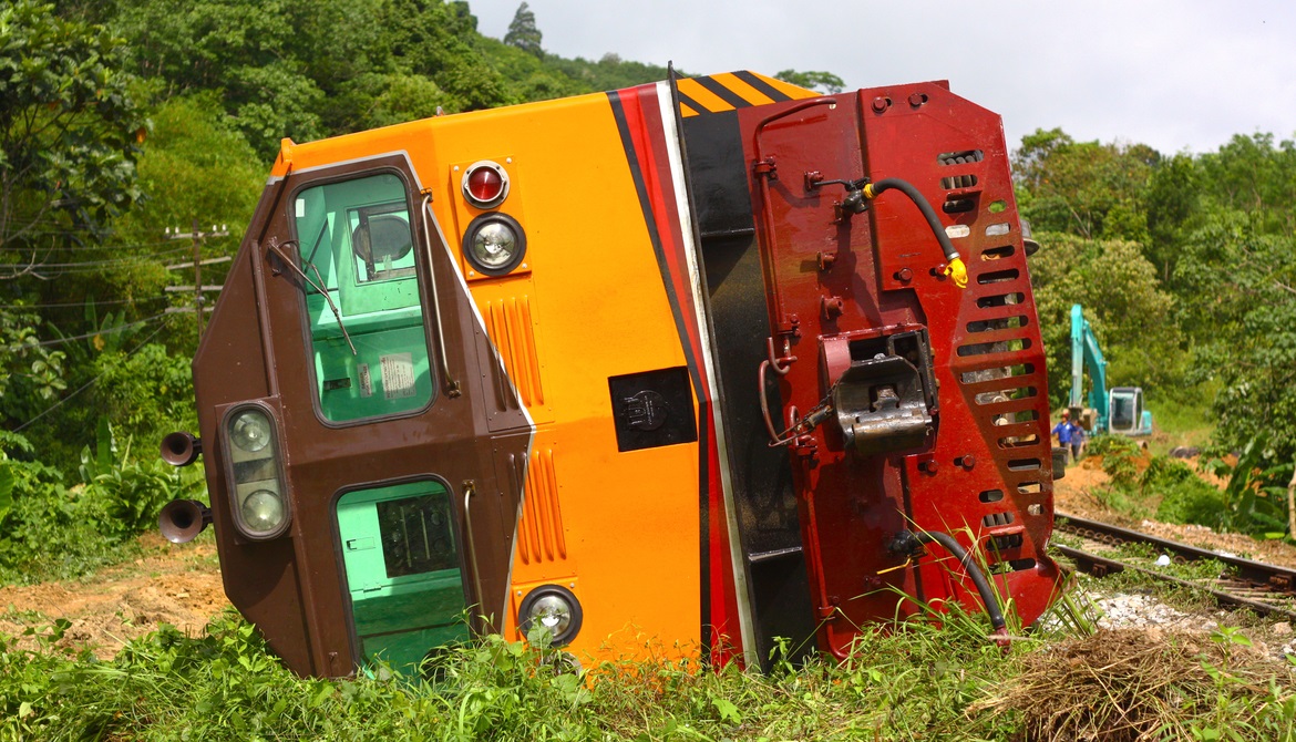 train car derailed and laying on its side