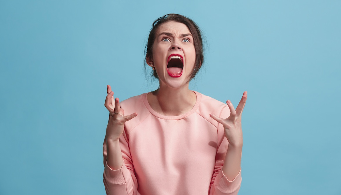 frustrated young woman screaming