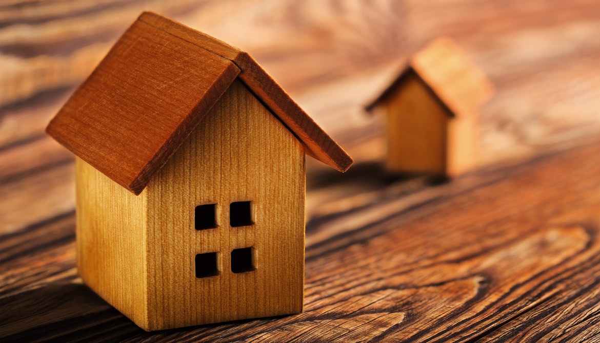 wooden house on a wooden table