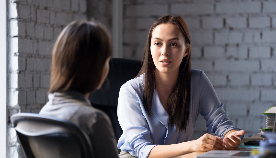 young female financial advisor counseling credit union member