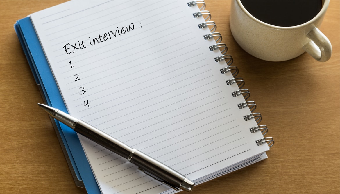 Exit interview checklist written on notebook