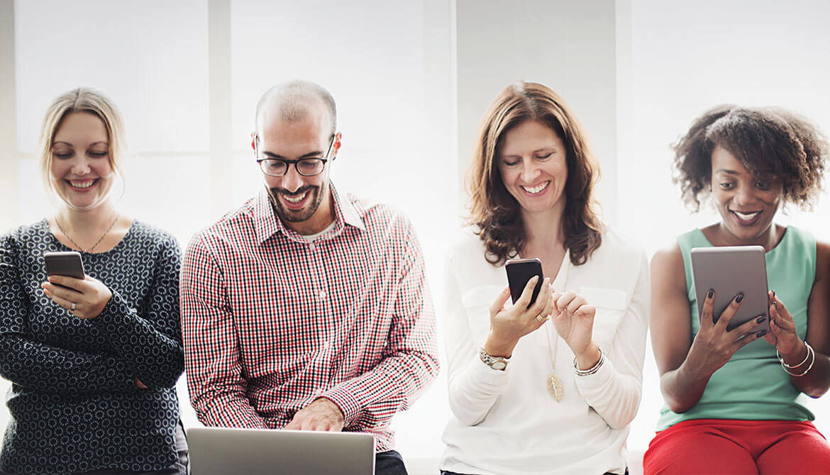 diverse group of people using different mobile devices