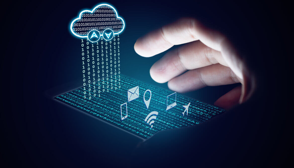 shadowy hand using a smart device depicting digital images of cloud computing and internet access