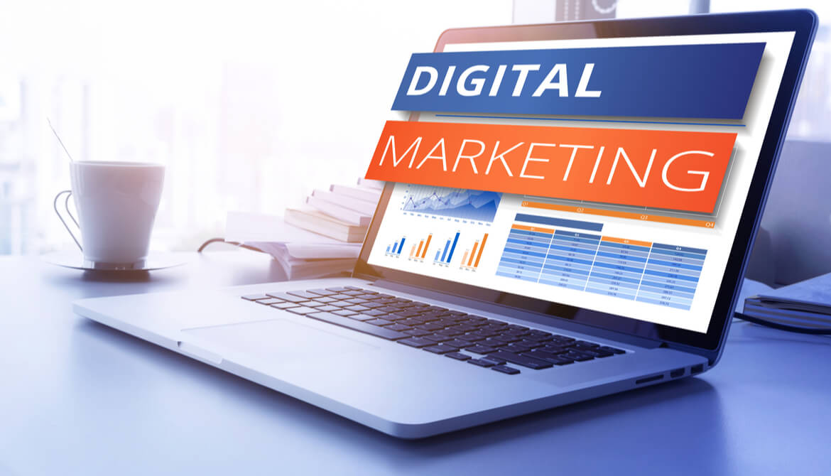 the words digital marketing popping out of a laptop screen