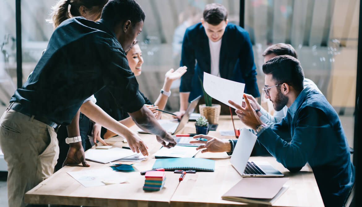 diverse group of colleagues brainstorm during a collaborative meeting