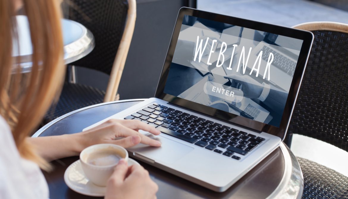 woman using laptop to view webinar