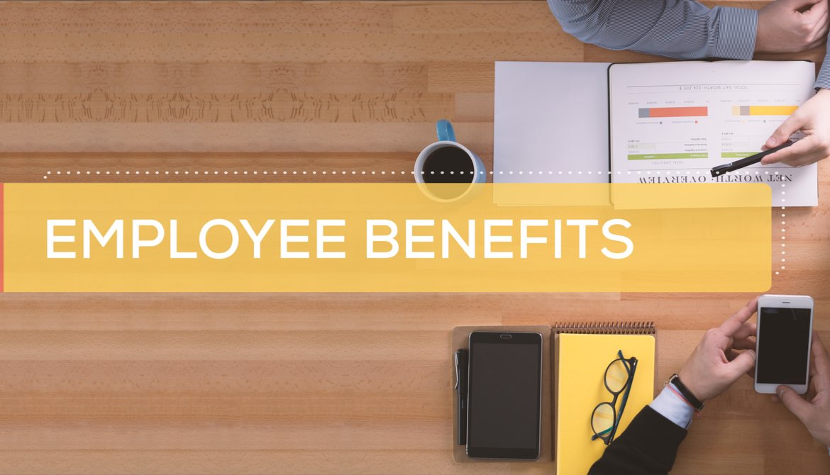 employee benefits tag with two men working with notebook, phone and laptop