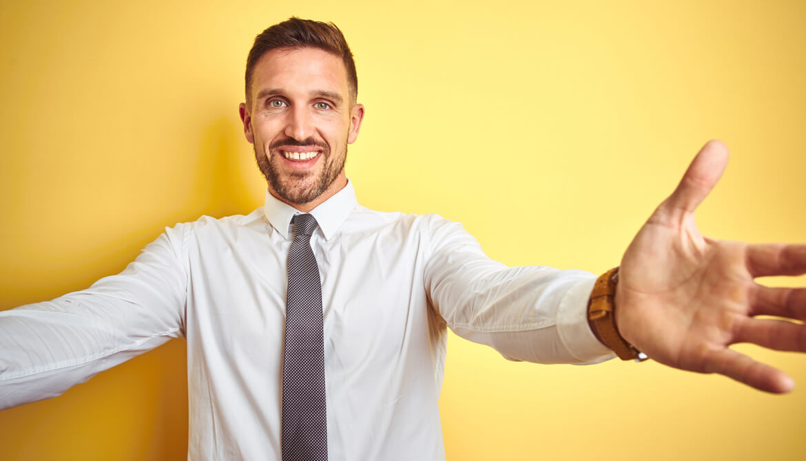 business man with arms out for embrace