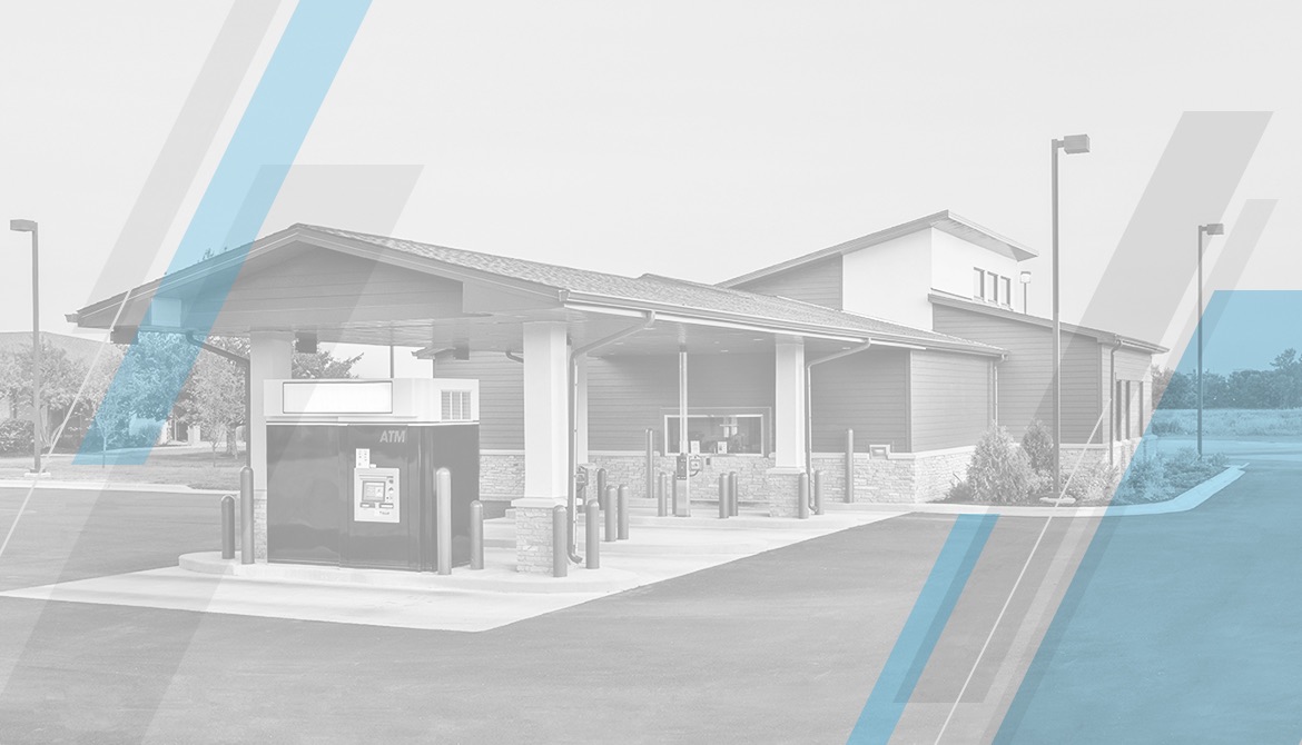 grayscale image of credit union branch with geometric blue and gray overlay