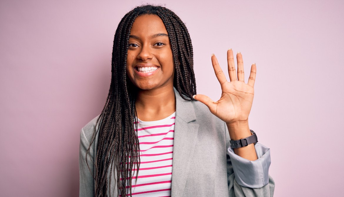 female executive with five fingers up