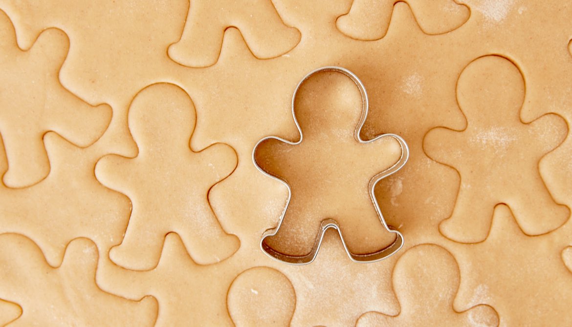 gingerbread man cutter making cookies