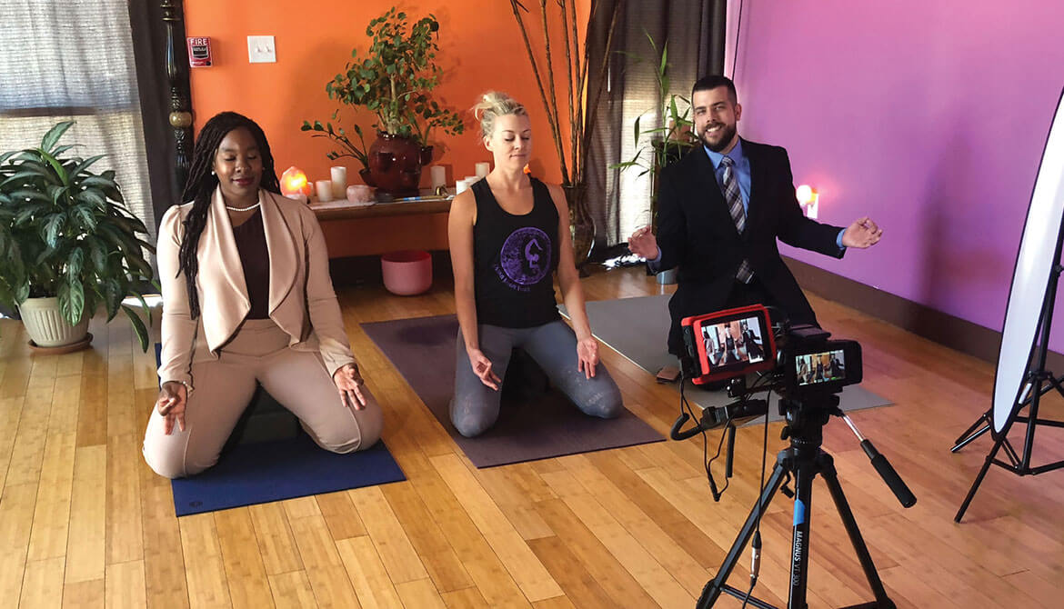 SAFE Credit Union employees doing yoga with local studio owner