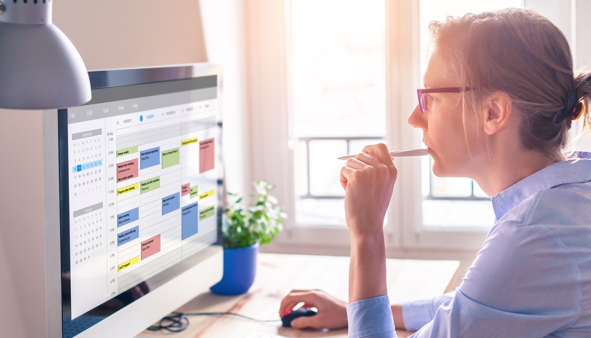woman reviewing time management calendar app