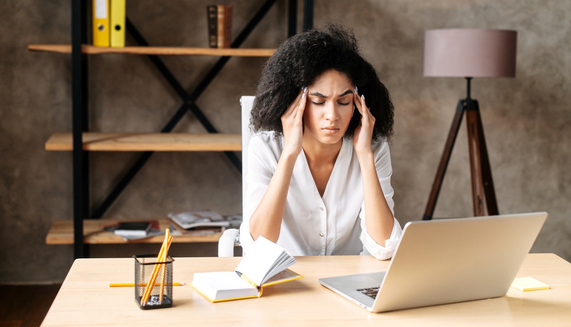young Black professional woman feeling stressed