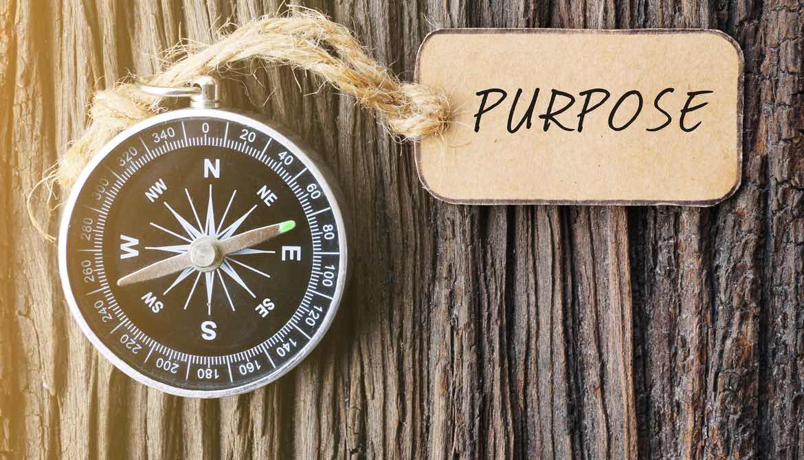 compass with tag that says purpose