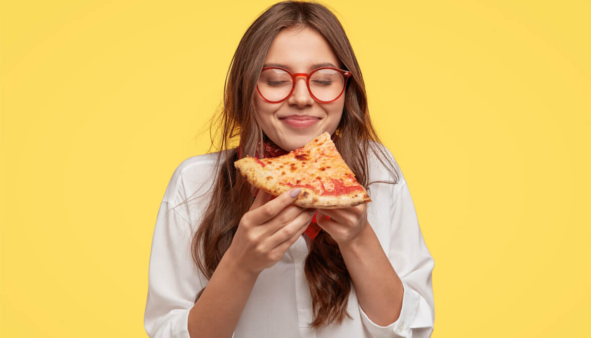 young person anticipates enjoying a slice of pizza