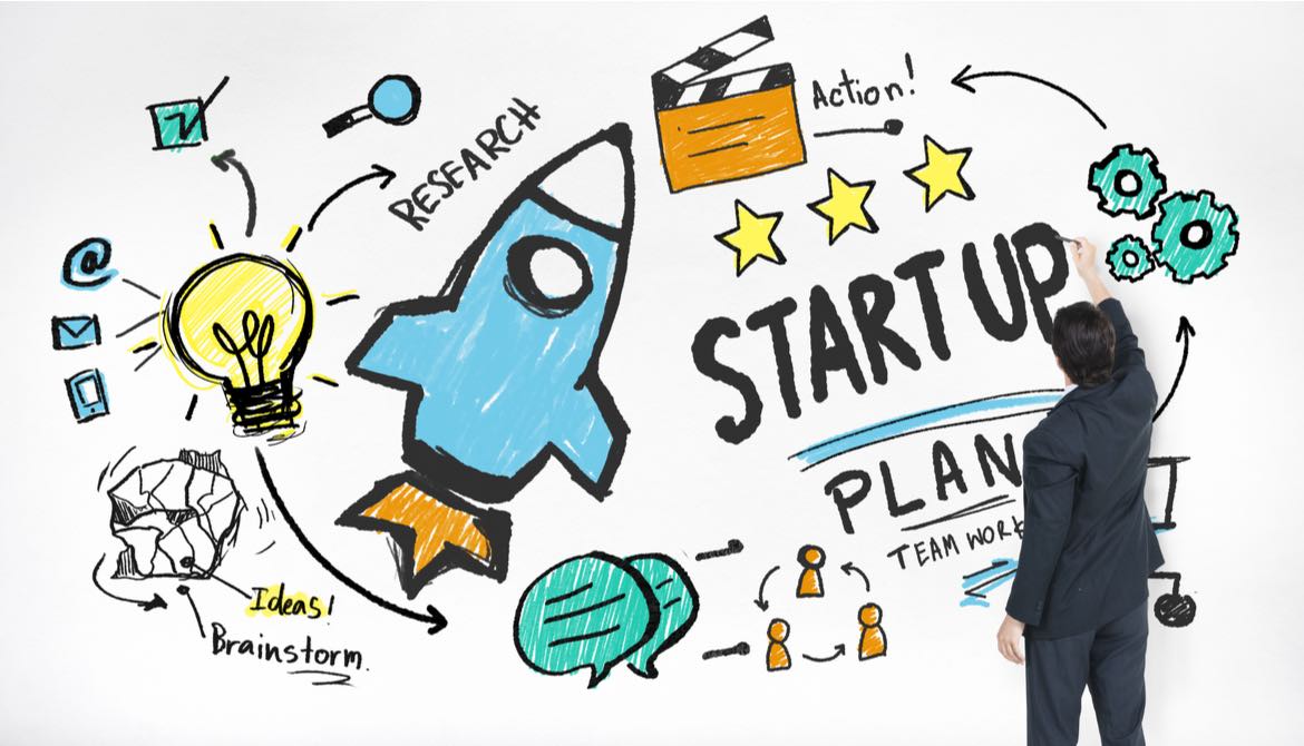 executive drawing illustration of start-up company ideas including a rocket and a light bulb