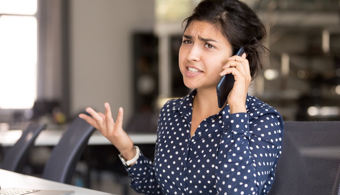 unhappy woman on the phone