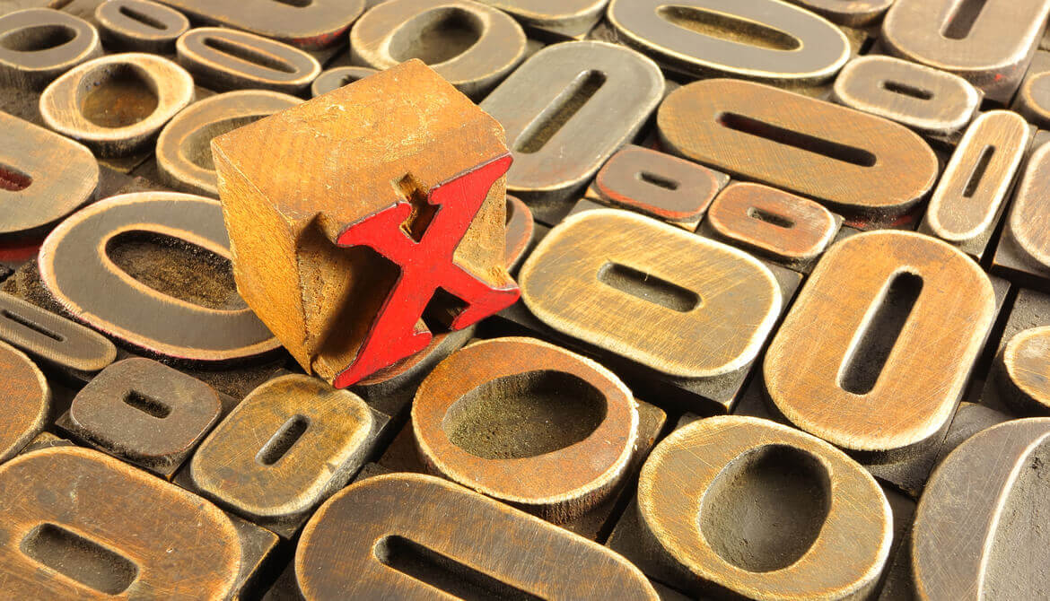 wood letter presses all Os with one red X