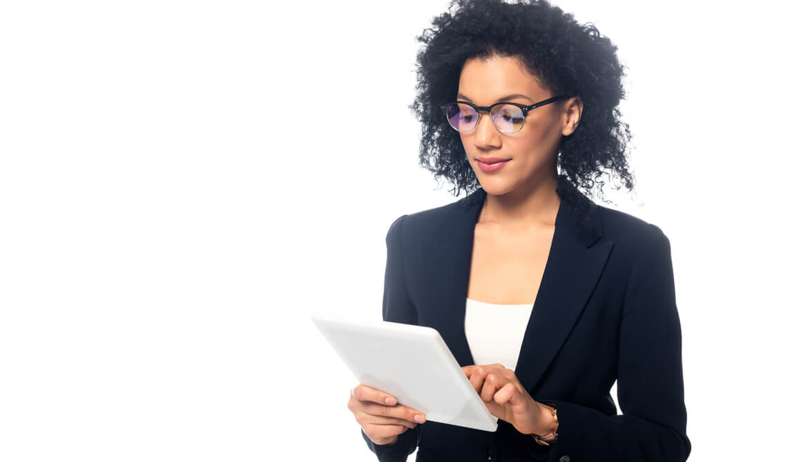 African-American businesswoman wearing glasses using a tablet
