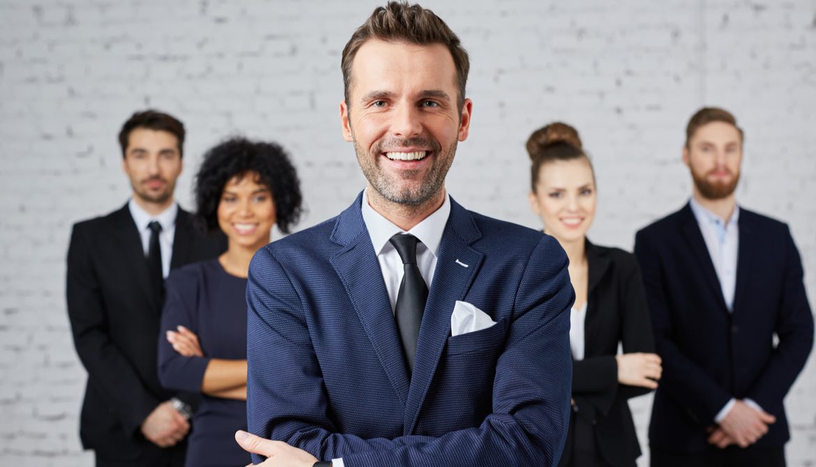 leader in front of diverse group of executives