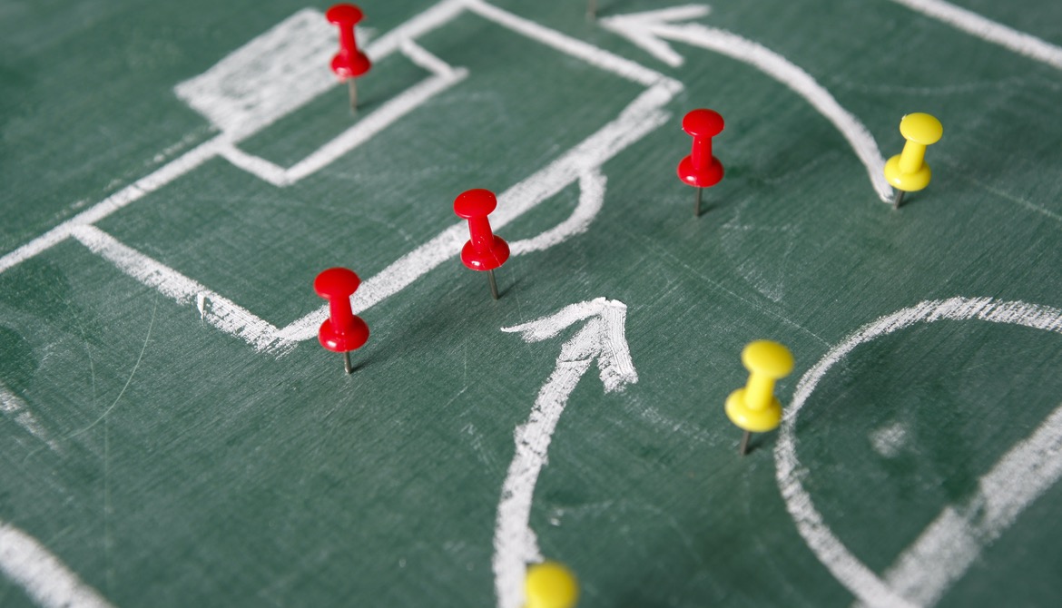 soccer game strategy diagram using chalkboard and push pins